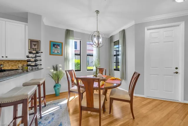 a view of a dining room with furniture and window