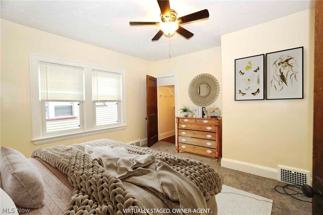 2168 Edgewood Road Cleveland, OH 44118 - Photo 11 of 41 1st fl bedroom with carpet and ceiling fan plus walk in closet.