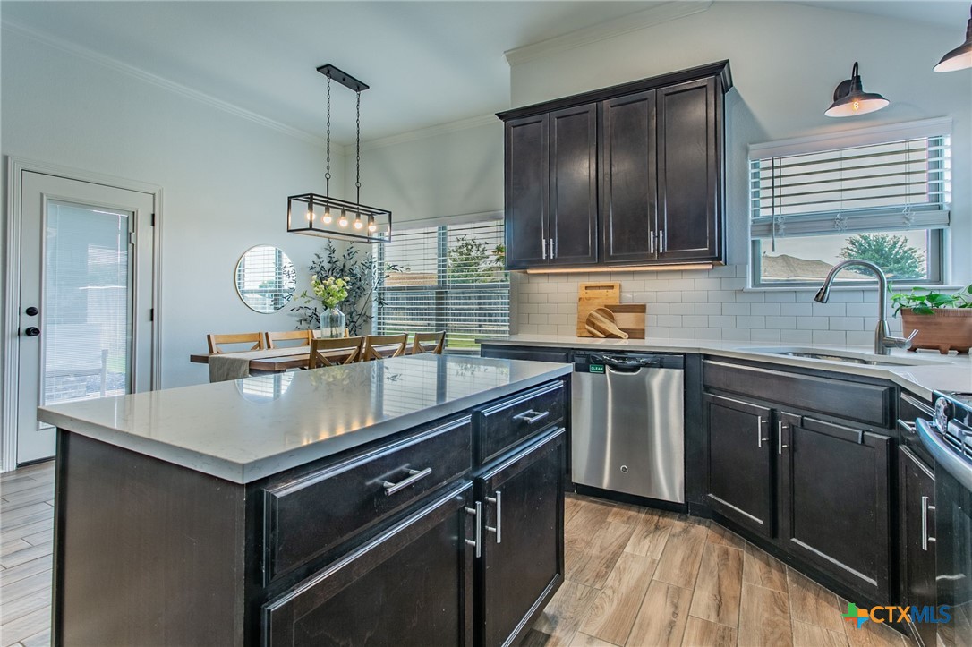 8304 Split Trl Cove Temple, TX 76502 - Photo 7 of 28 a kitchen with a sink stove and microwave