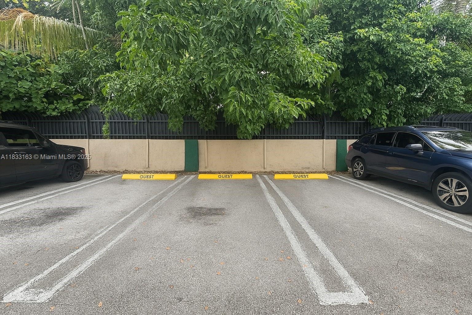 13101 Memorial Highway, Unit 215 Miami, FL 33161 - Photo 13 of 13 a view of a swimming pool and a car parked