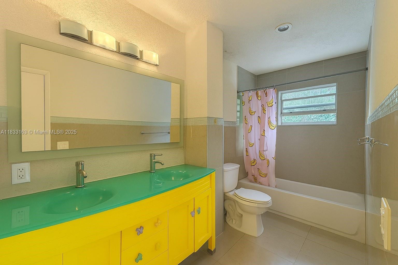 13101 Memorial Highway, Unit 215 Miami, FL 33161 - Photo 8 of 13 a bathroom with a granite countertop sink toilet and shower