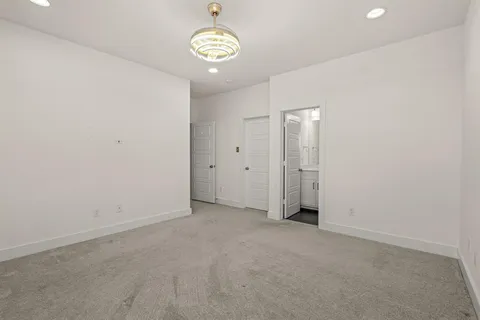 an empty room with a empty space and a window