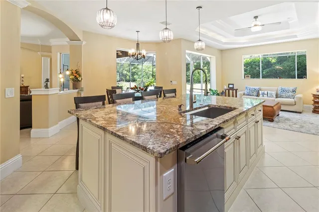 a kitchen with granite countertop lots of counter top space and stainless steel appliances