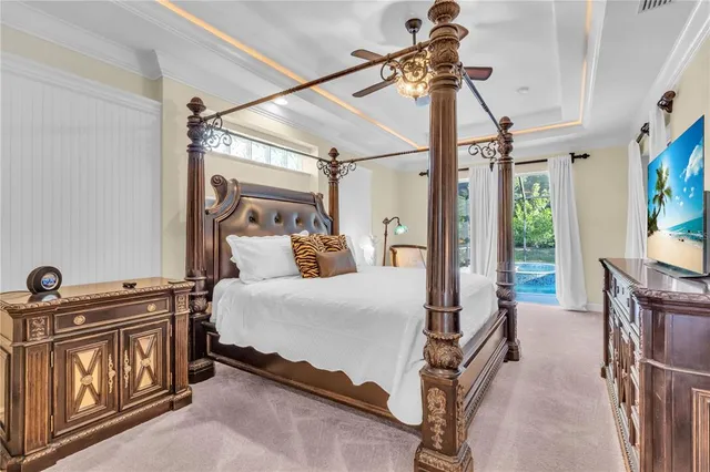 a bedroom with a bed next to a window with the outer view