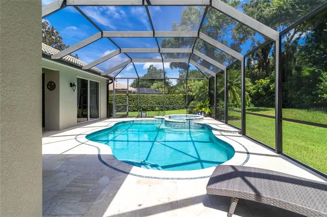 a view of a backyard with a small deck and a backyard