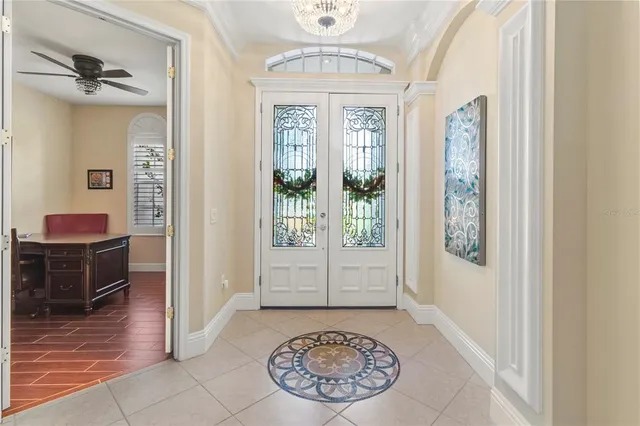a view of a hallway with windows and stairs