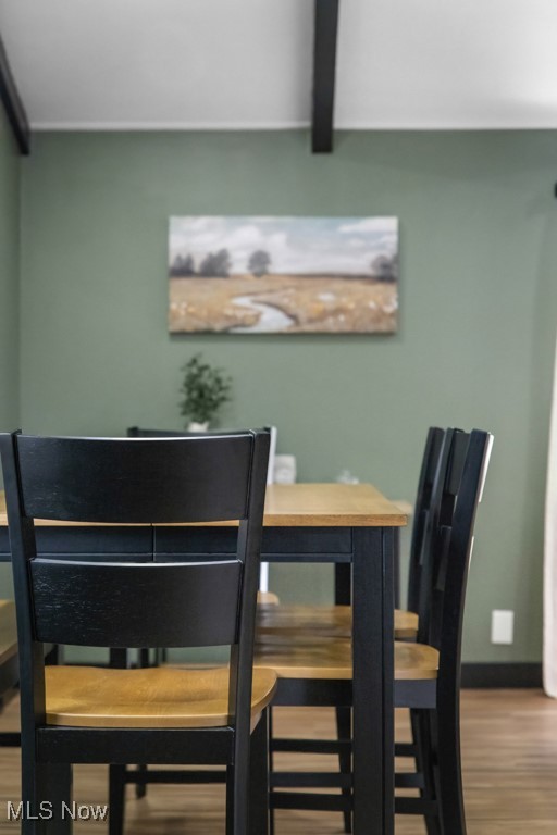 4551 17th Street Northwest Canton, OH 44708 - Photo 13 of 39 Dining room featuring baseboards, wood finished floors, and beamed ceiling