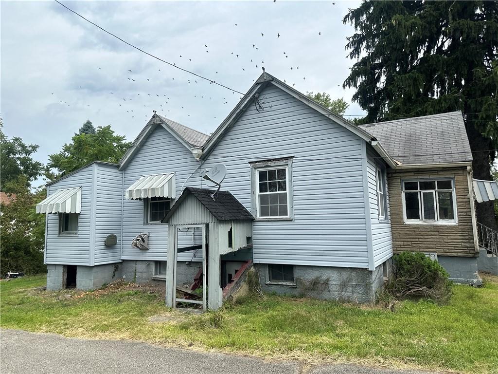 1034 Logan Road North Versailles, PA 15137 - Photo 2 of 18 a front view of a house with a yard
