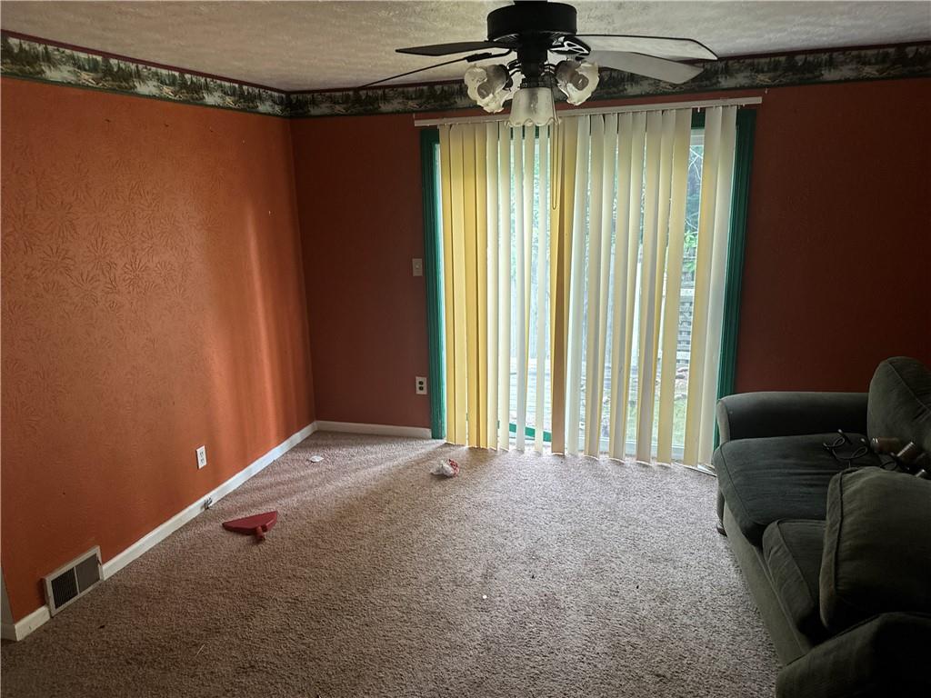 1034 Logan Road North Versailles, PA 15137 - Photo 6 of 18 a view of an empty room with a window