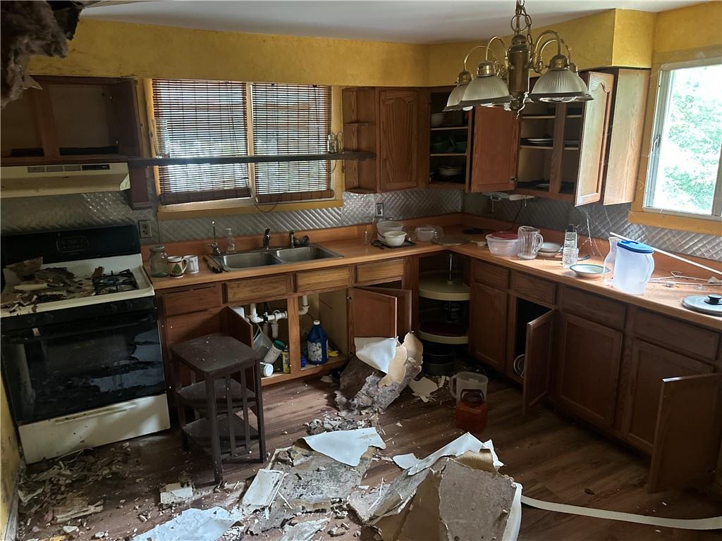 1034 Logan Road North Versailles, PA 15137 - Photo 9 of 18 a kitchen with a sink appliances and a counter top space