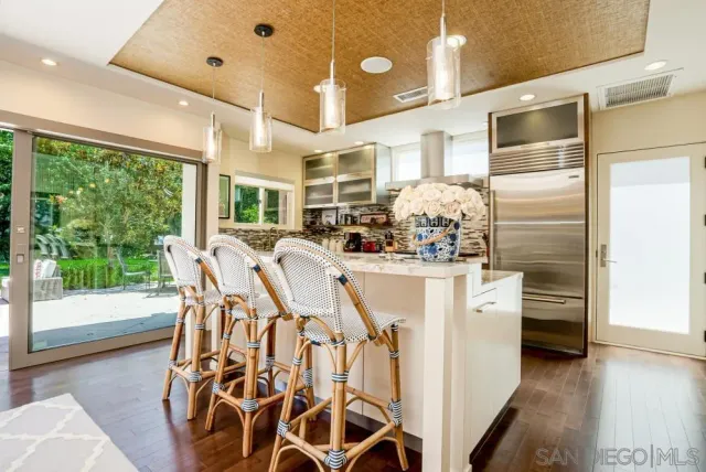 a very nice looking dining room with a large window