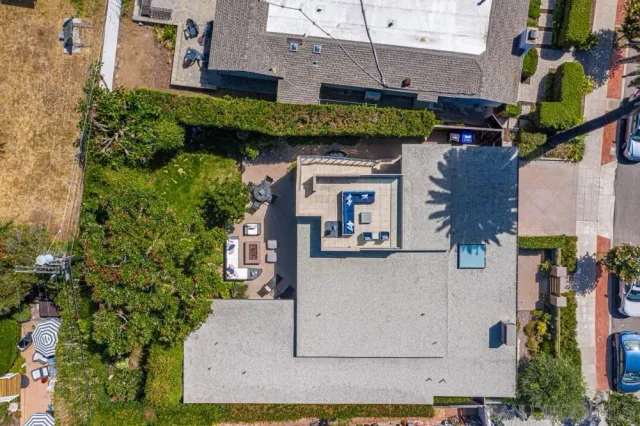 an aerial view of a house with outdoor space