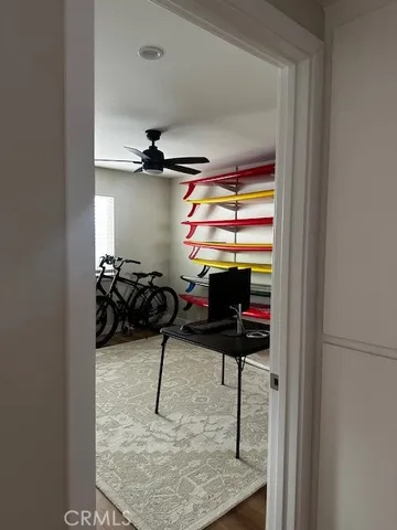 a view of a room with gym equipment and a window