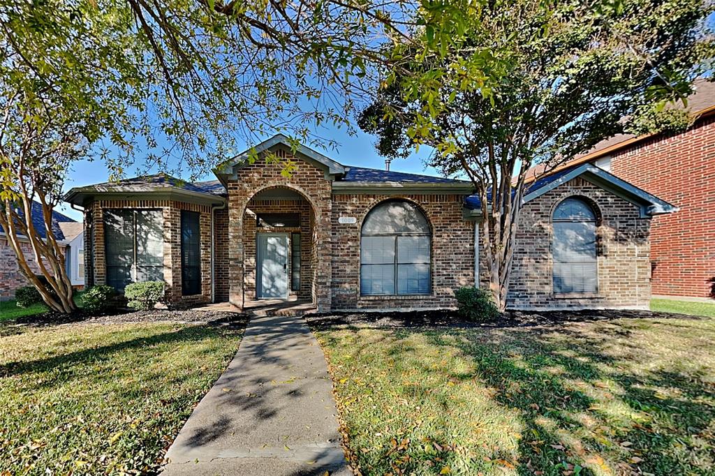 1009 Schrade Trail Mesquite, TX 75181 - Photo 1 of 19 View of front facade with a front yard and brick siding