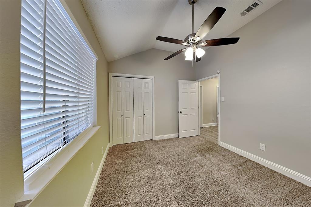 1009 Schrade Trail Mesquite, TX 75181 - Photo 13 of 19 Unfurnished bedroom with carpet floors, ceiling fan, a closet, and high vaulted ceiling