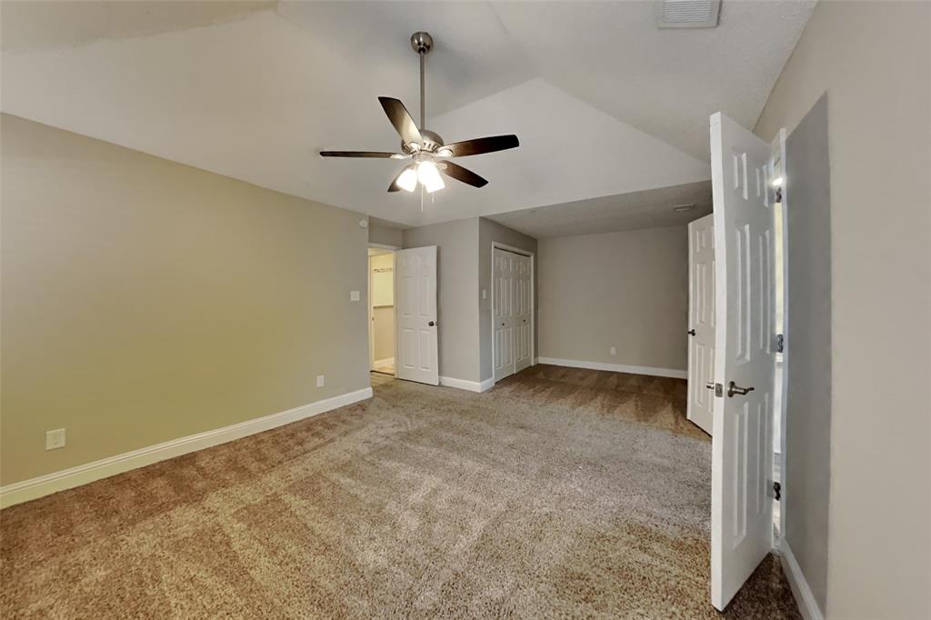 1009 Schrade Trail Mesquite, TX 75181 - Photo 6 of 19 Unfurnished bedroom featuring light colored carpet, a closet, lofted ceiling, and ceiling fan