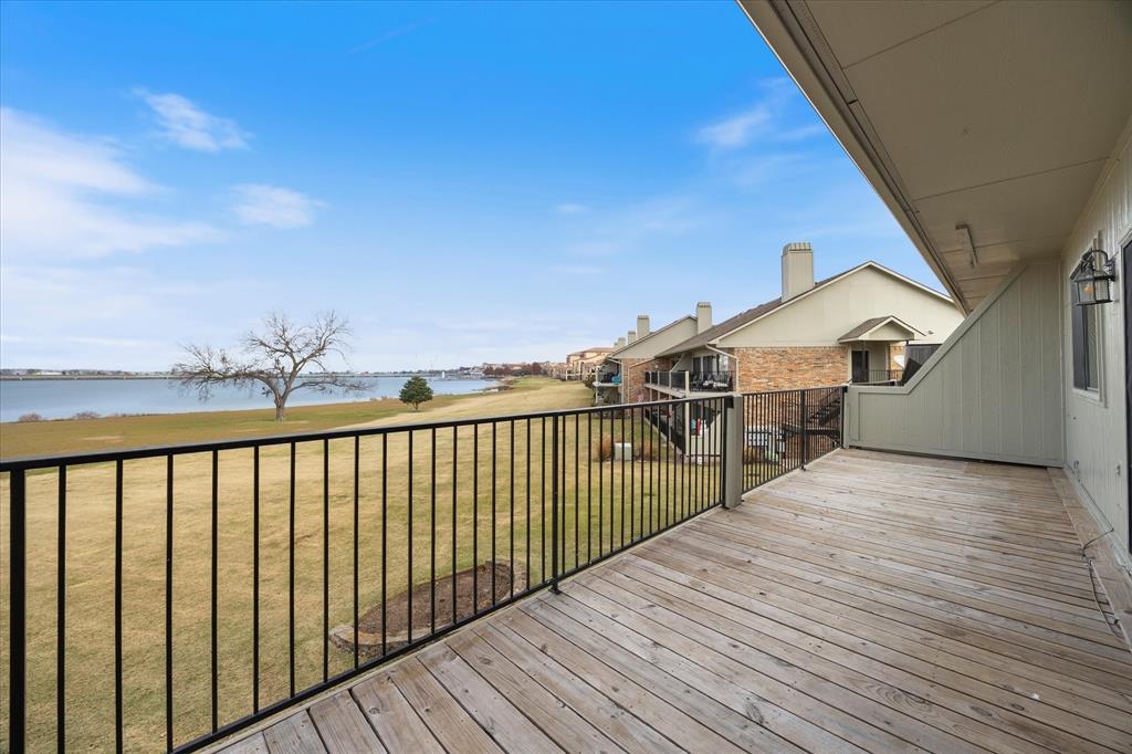 1908 Signal Ridge Place Rockwall, TX 75032 - Photo 16 of 28 a view of a balcony with wooden floor