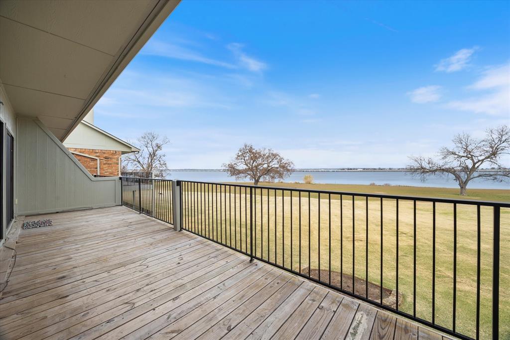 1908 Signal Ridge Place Rockwall, TX 75032 - Photo 17 of 28 a view of a balcony with wooden floor