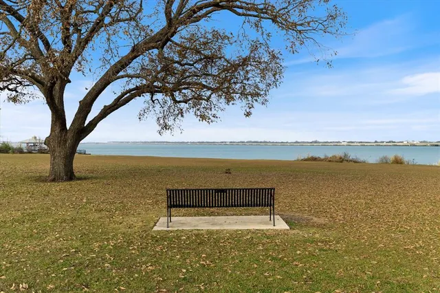 a view of a lake with a yard