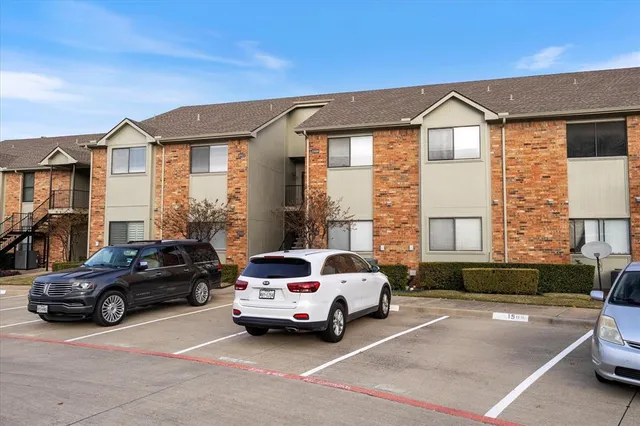 a view of a car parked in front of a house