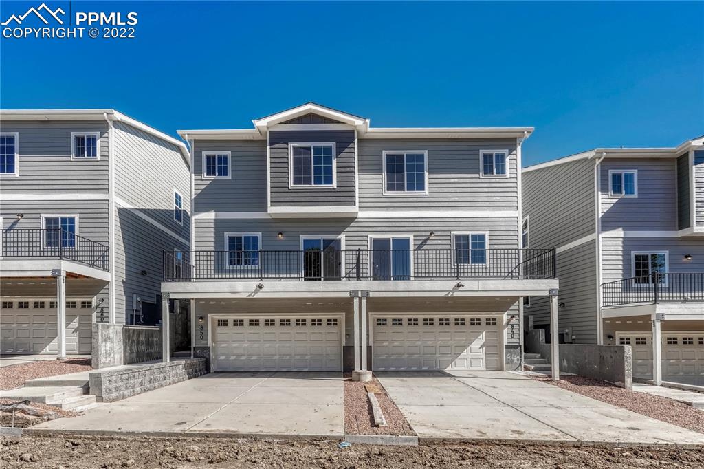 840 Promontory Rock Grove Colorado Springs, CO 80905 - Photo 2 of 11 a front view of a house with yard