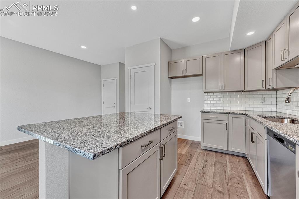 840 Promontory Rock Grove Colorado Springs, CO 80905 - Photo 5 of 11 a kitchen with a sink stove and cabinets