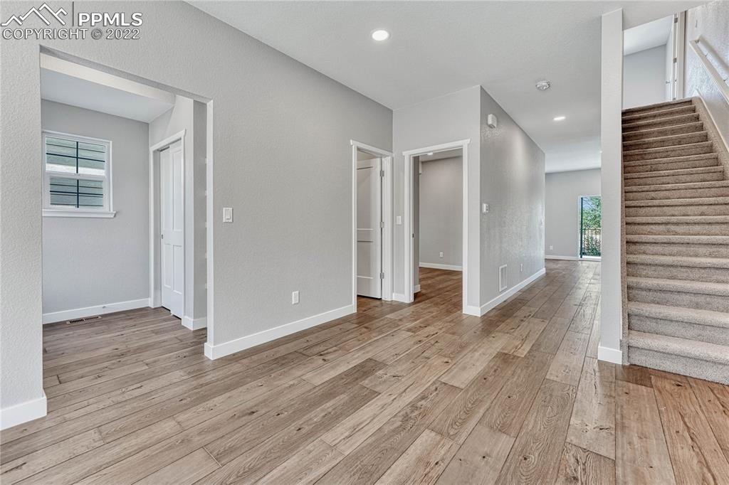 840 Promontory Rock Grove Colorado Springs, CO 80905 - Photo 7 of 11 a view of hallway with wooden floor
