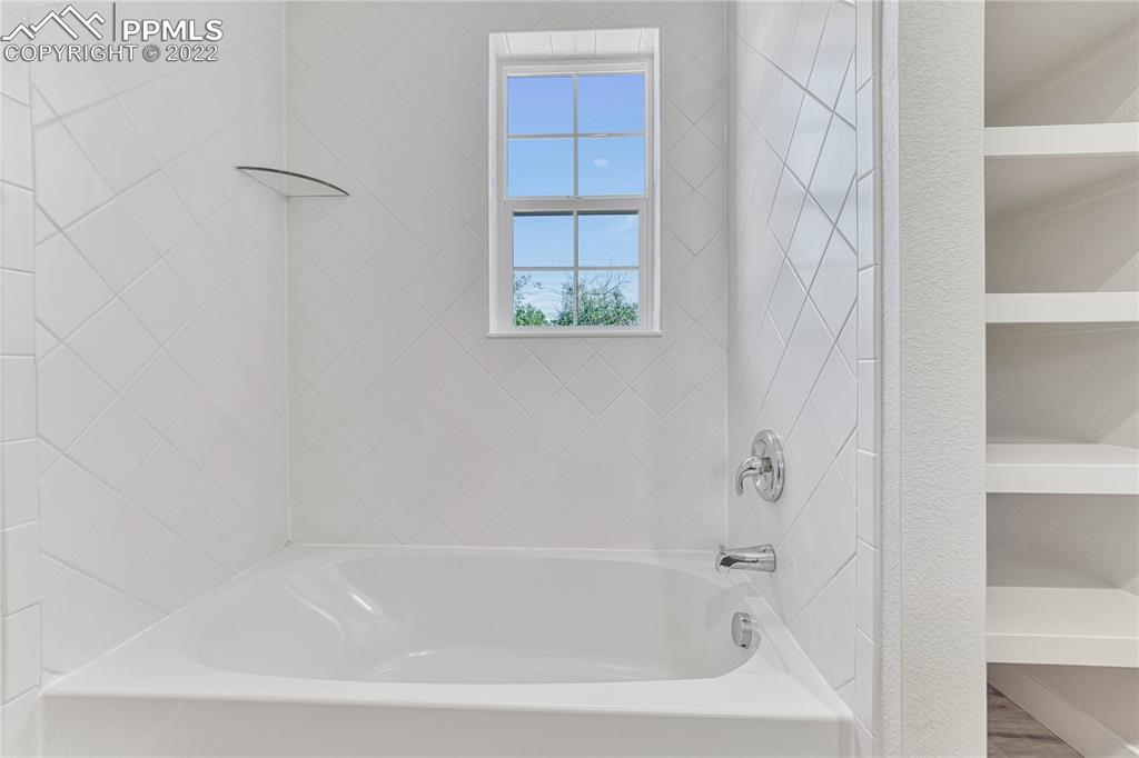 840 Promontory Rock Grove Colorado Springs, CO 80905 - Photo 9 of 11 a bathroom with a bathtub