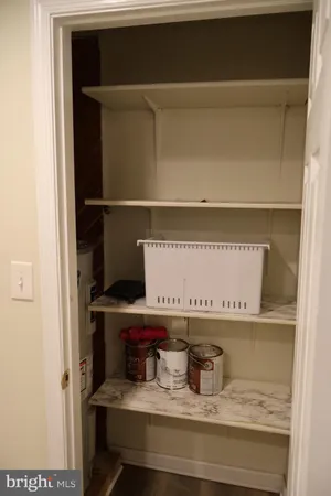a room with a wall and a microwave