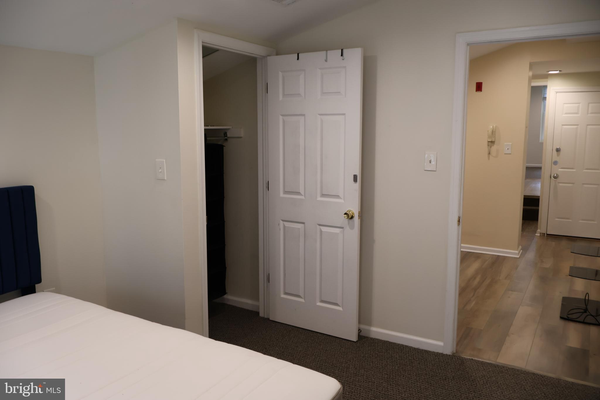 33 South 19th Street Philadelphia, PA 19103 - Photo 4 of 25 a bedroom with a bed and wooden floor