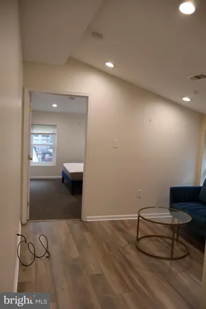 a view of a livingroom with furniture and a ceiling fan