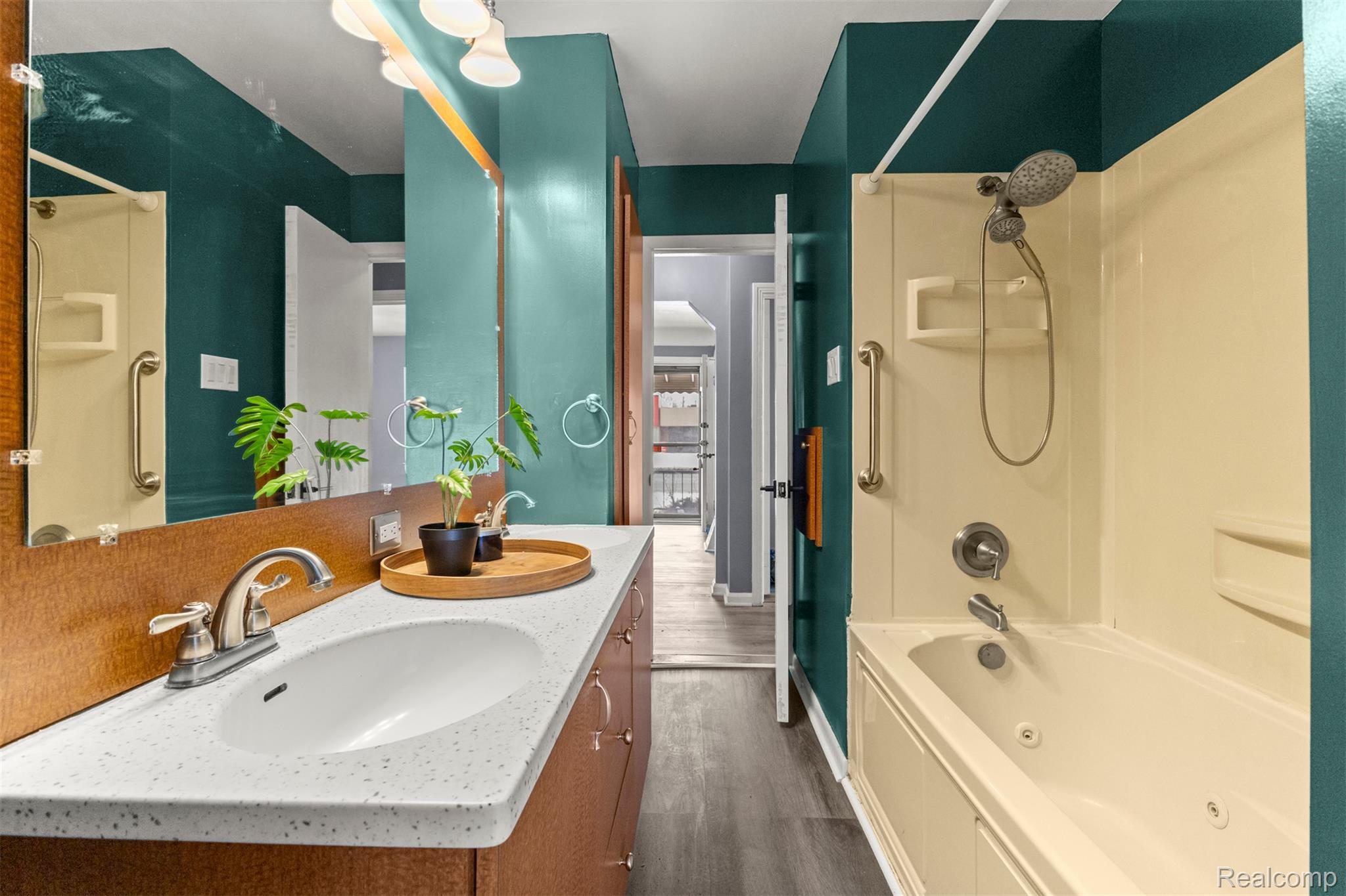 14716 Eureka Road Southgate, MI 48195 - Photo 23 of 42 Bathroom with a combined bath / shower with jetted tub, double vanity, and dark wood-style floors