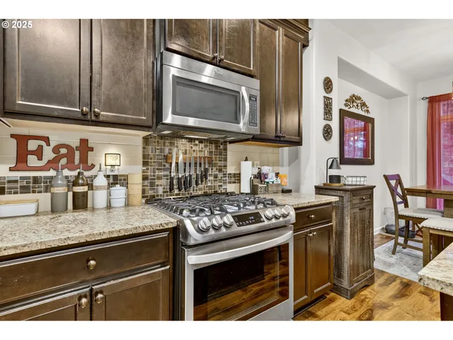 a view of kitchen island with sink table and chairs