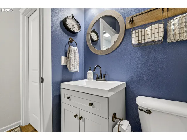 a bathroom with a toilet and a sink