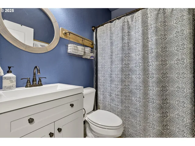 a utility room with sink dryer and washer