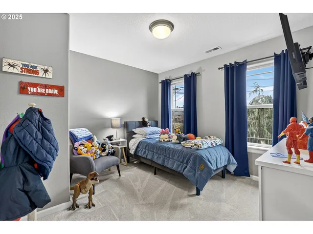 a bedroom with a bed and a dresser