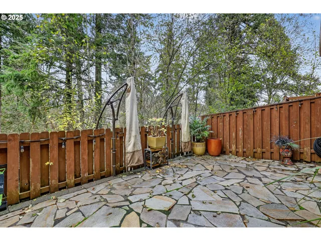 a view of a backyard with sitting area