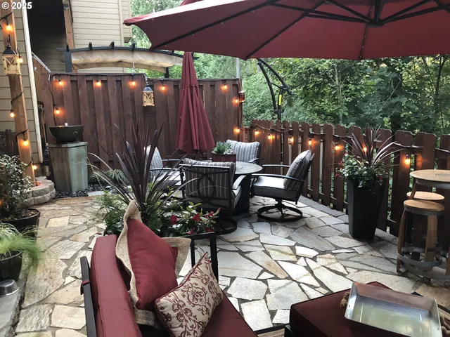 a view of a chairs and table in patio
