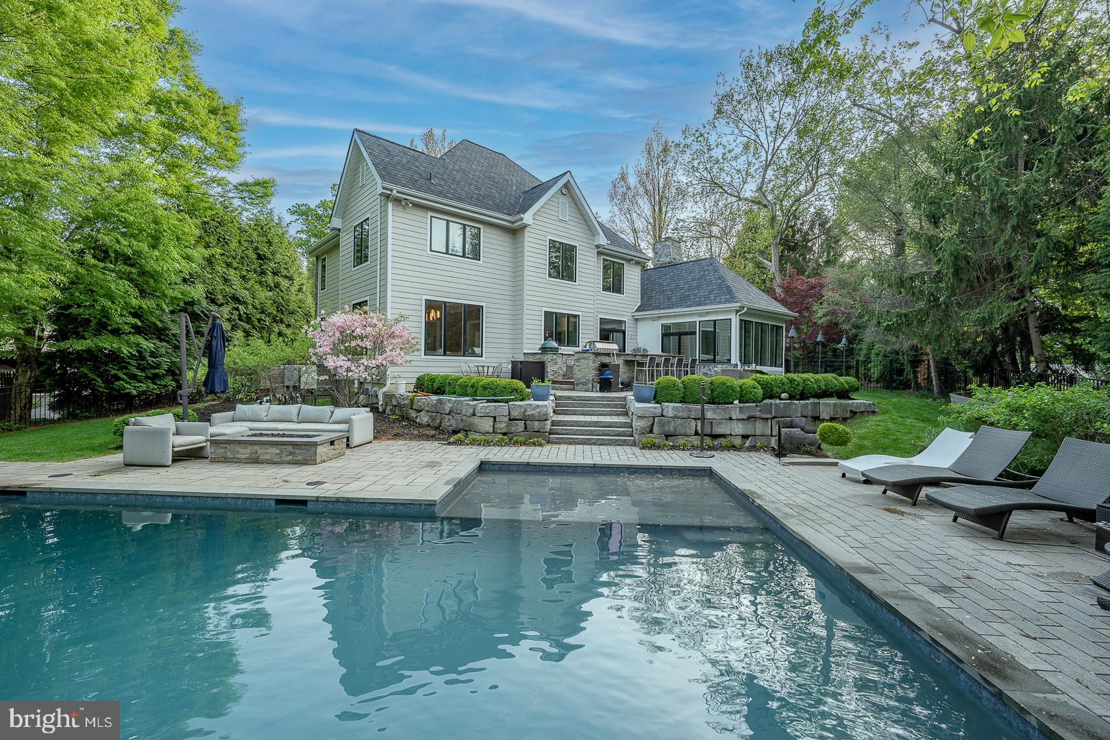 231 Righters Mill Road Gladwyne, PA 19035 - Photo 2 of 3 a view of house with swimming pool and outdoor seating