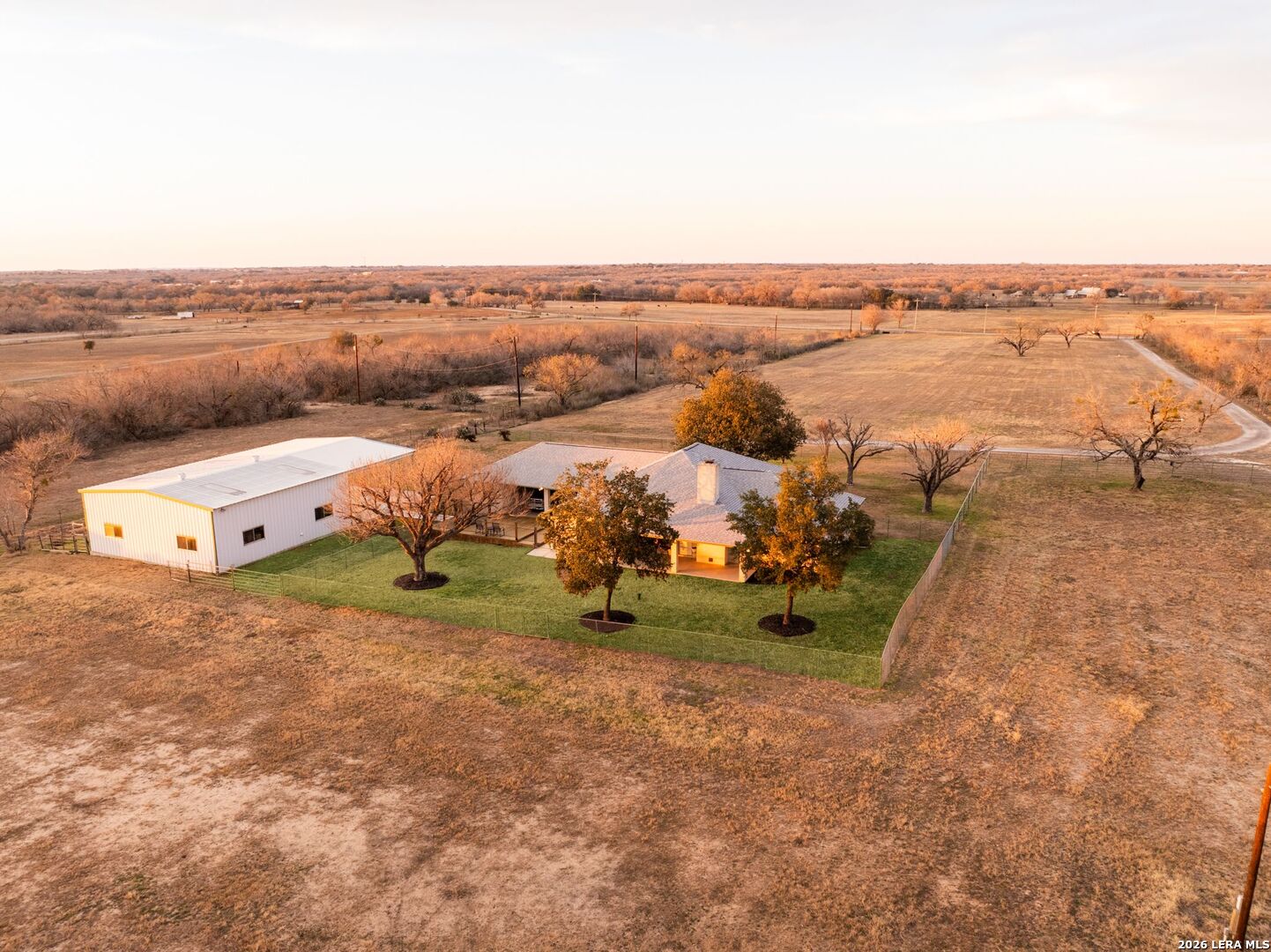 an aerial view of a house with outdoor space