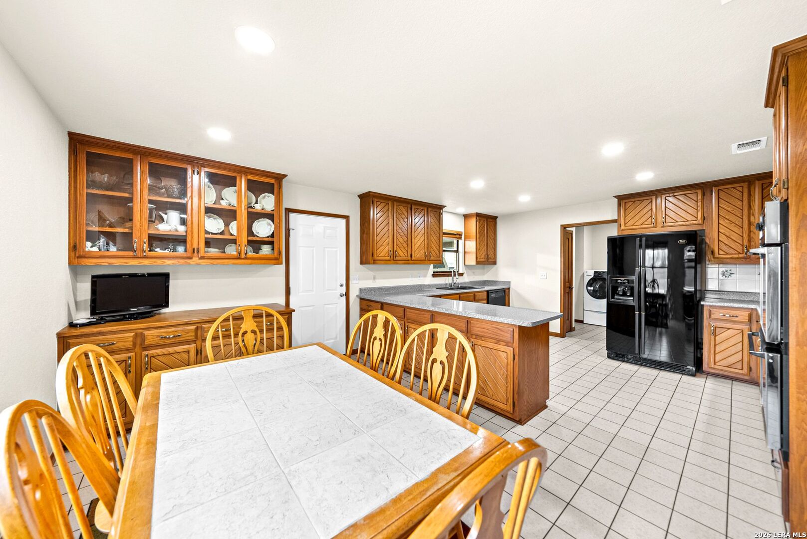 14320 La Vernia Road St. Hedwig, TX 78152 - Photo 11 of 71 a large kitchen with stainless steel appliances granite countertop a refrigerator and a stove top oven