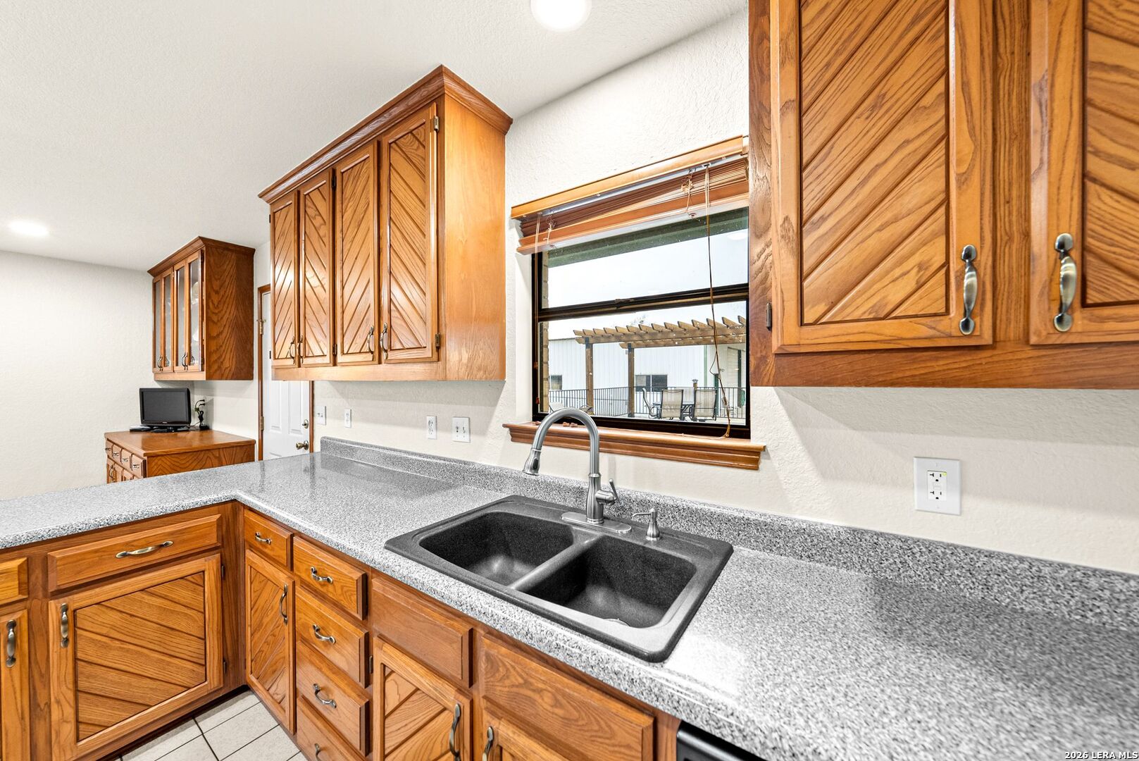 14320 La Vernia Road St. Hedwig, TX 78152 - Photo 13 of 71 a kitchen with stainless steel appliances granite countertop a sink a stove and a microwave oven
