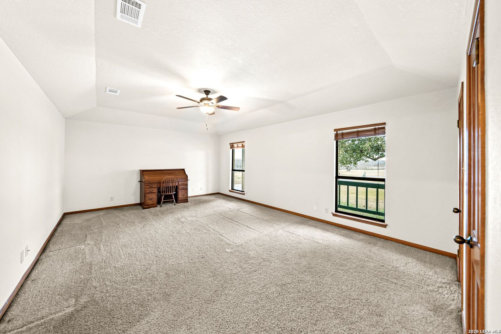 14320 La Vernia Road St. Hedwig, TX 78152 - Photo 16 of 71 an empty room with windows and ceiling fan