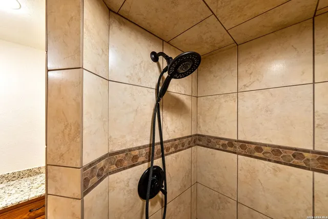 a bedroom with bed and a window