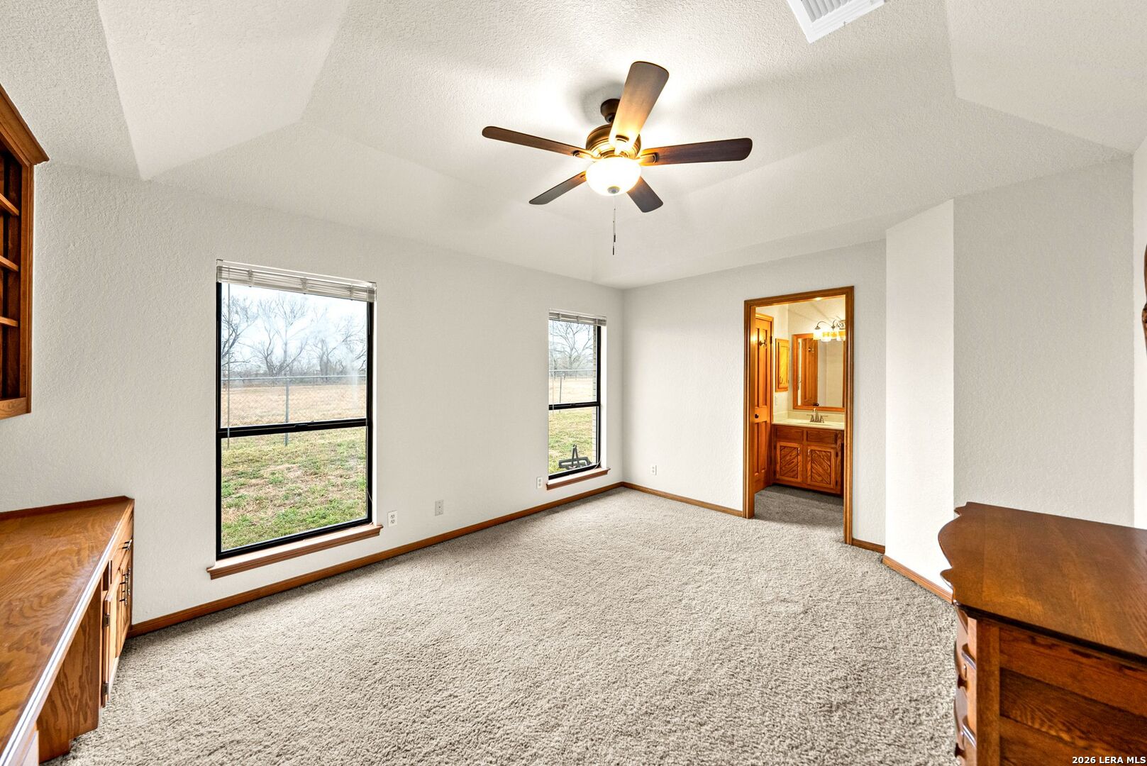 14320 La Vernia Road St. Hedwig, TX 78152 - Photo 23 of 71 a view of an empty room with window and wooden floor