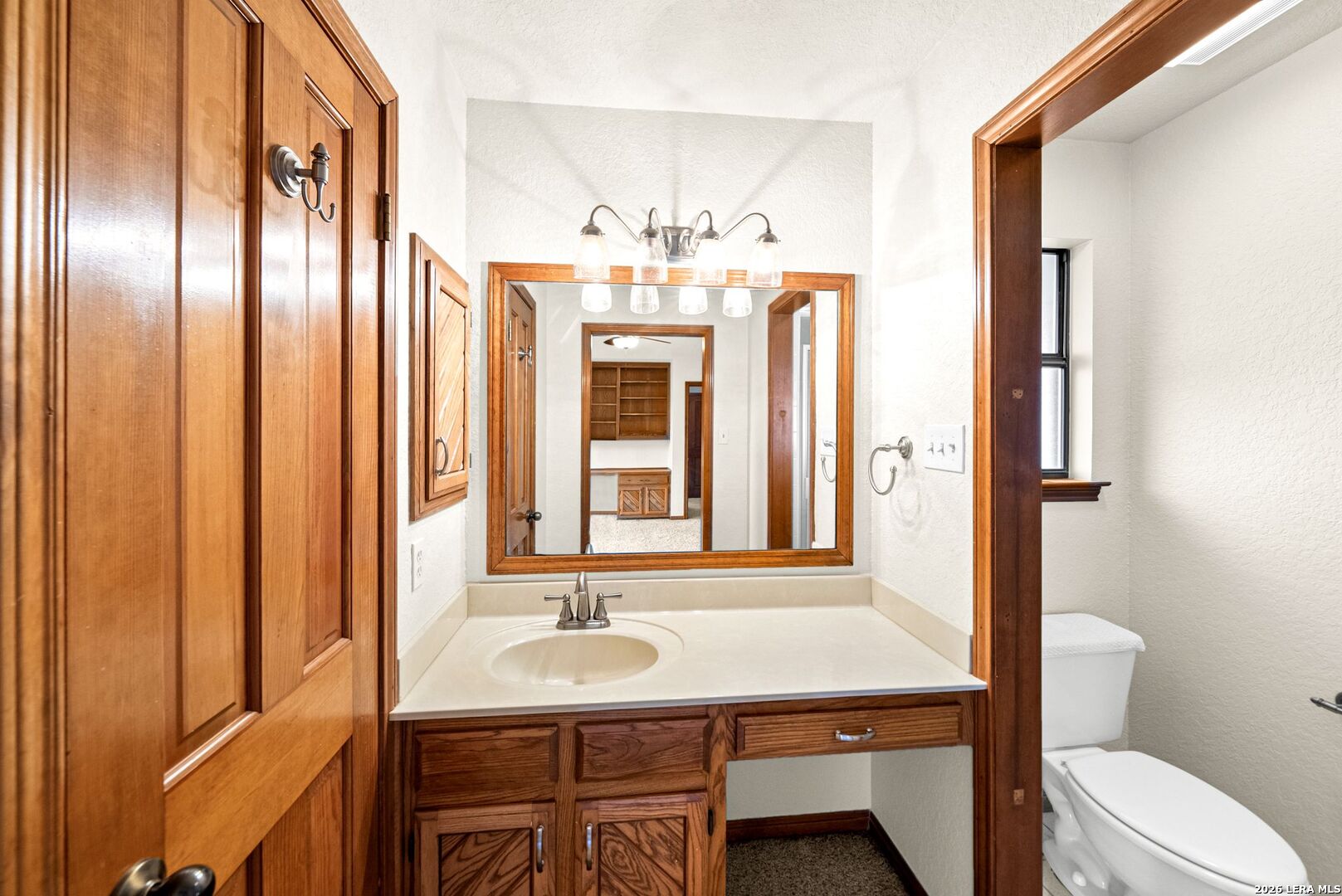 14320 La Vernia Road St. Hedwig, TX 78152 - Photo 24 of 71 a bathroom with a sink and a mirror