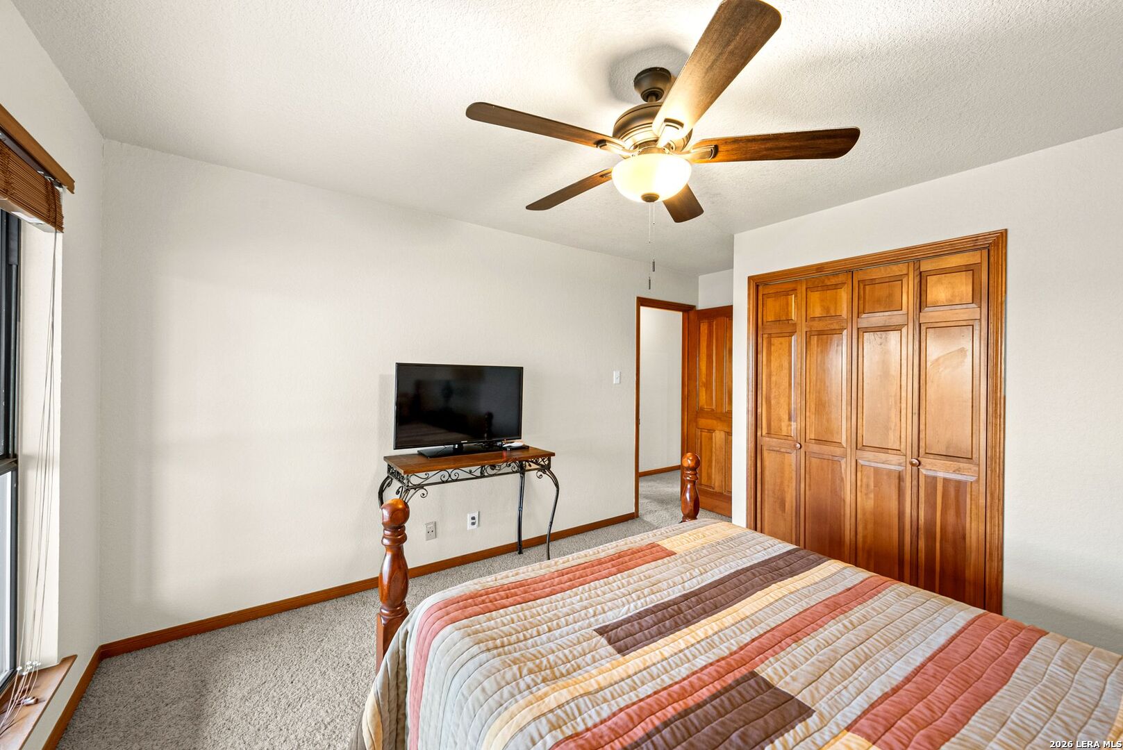14320 La Vernia Road St. Hedwig, TX 78152 - Photo 27 of 71 a bedroom with a bed and a flat screen tv