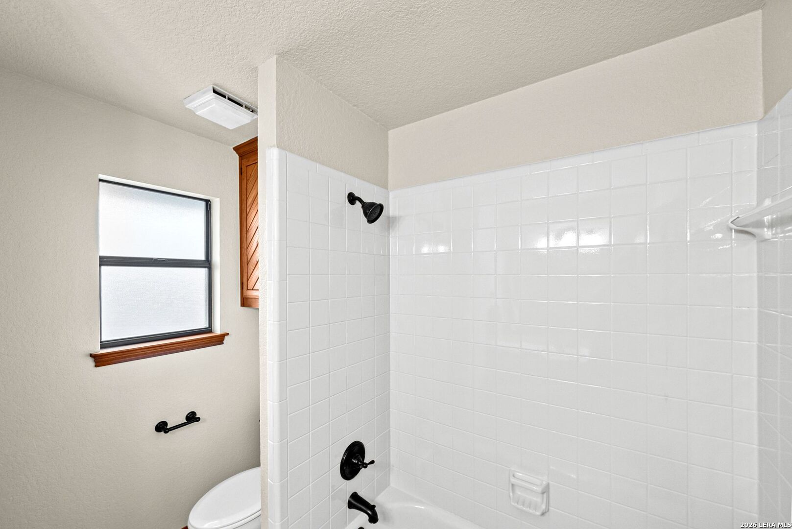 14320 La Vernia Road St. Hedwig, TX 78152 - Photo 29 of 71 a bathroom with a toilet a sink and shower