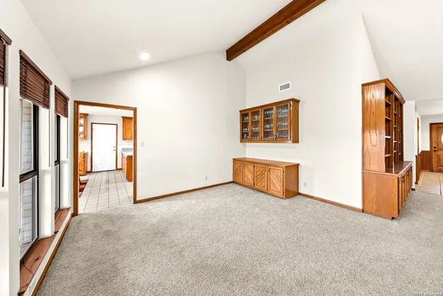 a kitchen with stainless steel appliances a stove refrigerator sink and cabinets