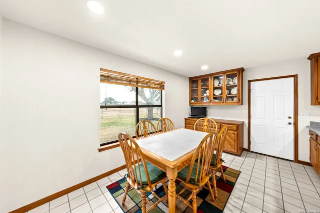 a kitchen with stainless steel appliances granite countertop a sink a stove and a microwave oven